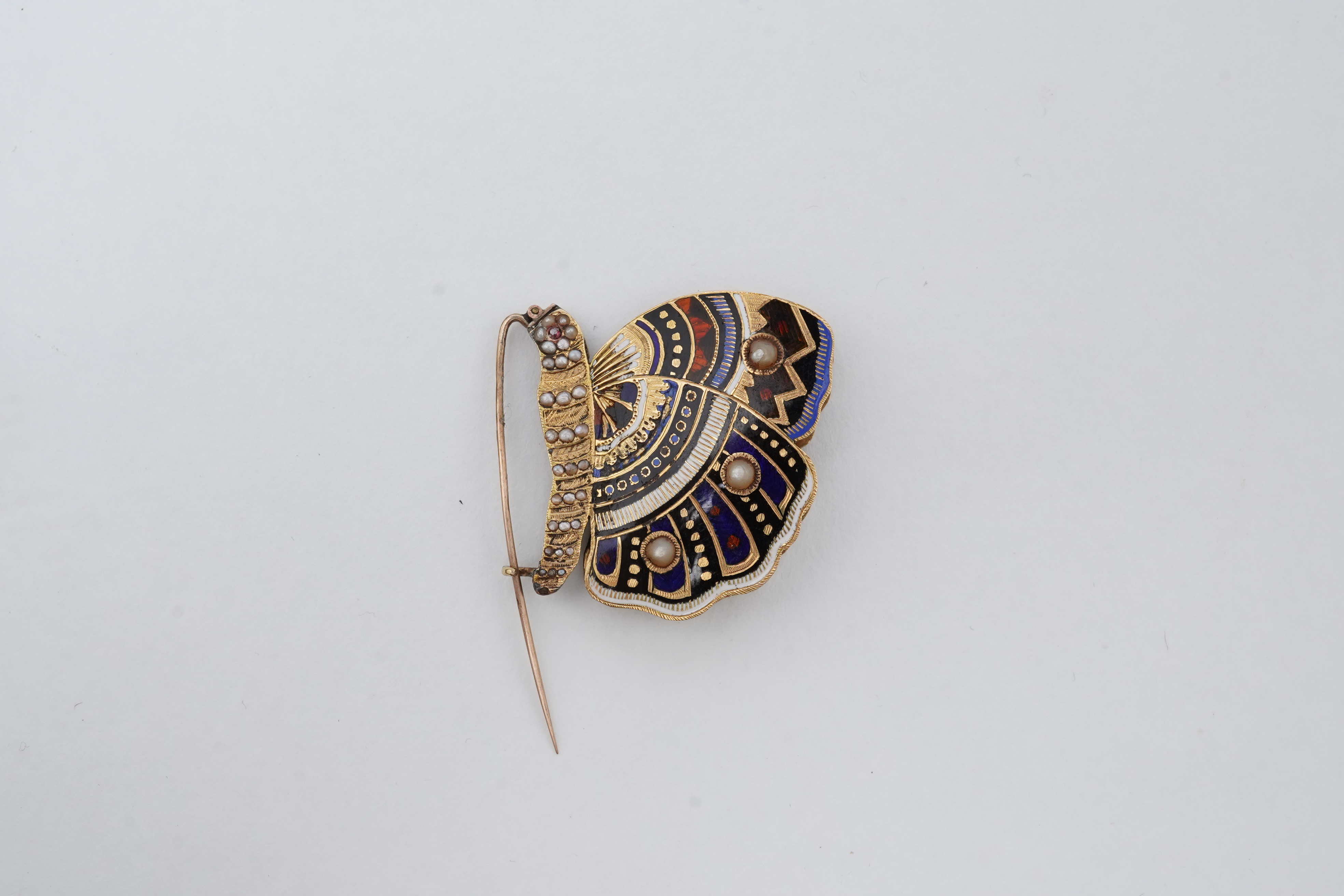 An enamel and seed pearl brooch, circa 1840